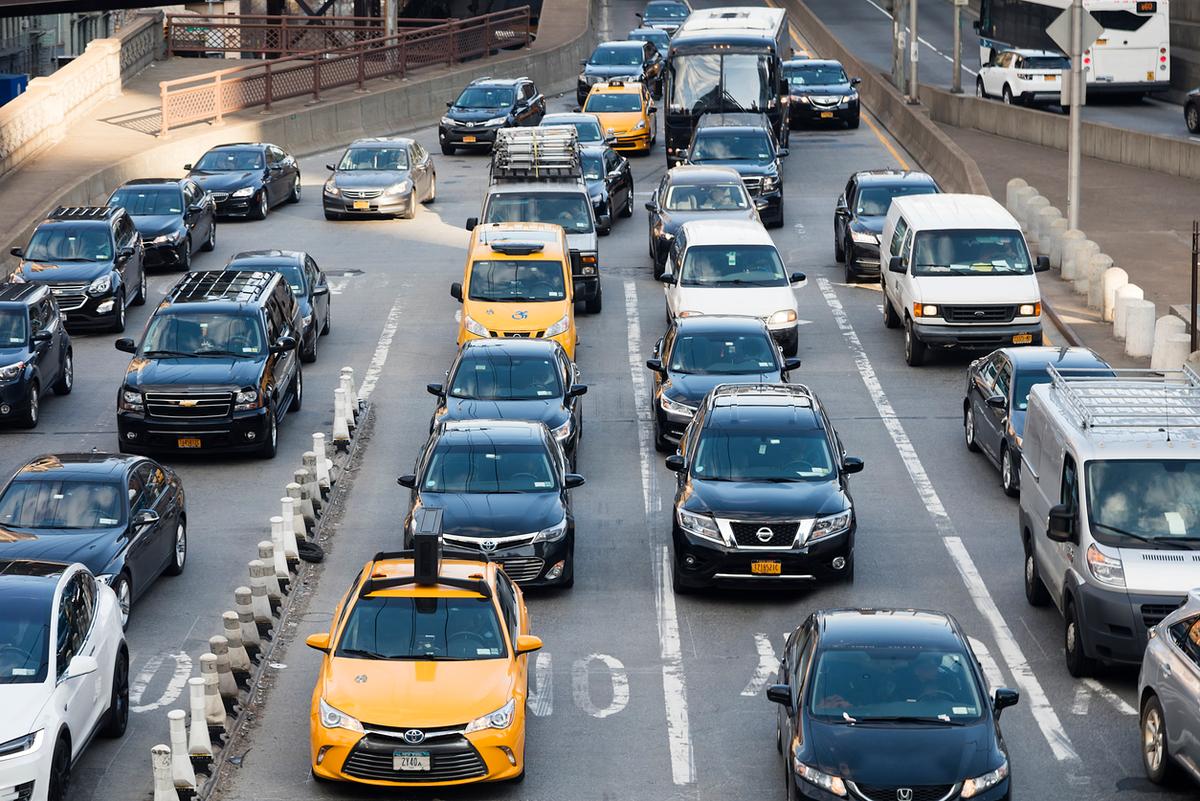 Busy city traffic illustrating uninsured motorist coverage.