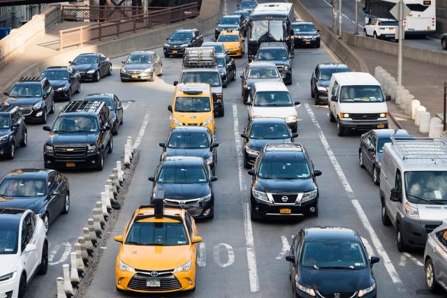 Busy city traffic illustrating uninsured motorist coverage.